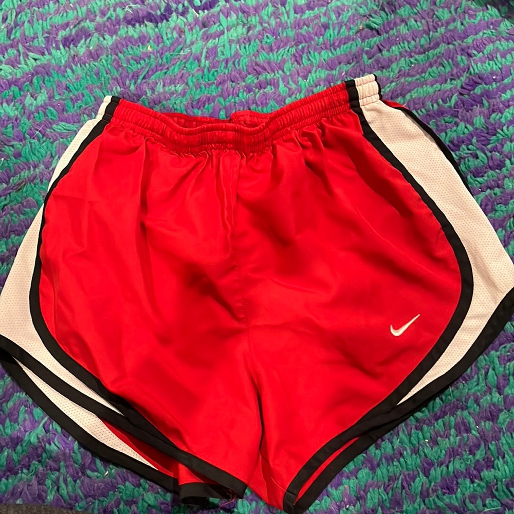 red Nike running shorts